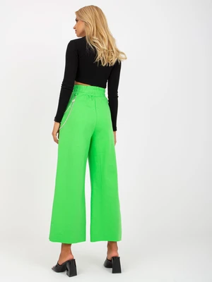 Light green wide sweatpants with holes