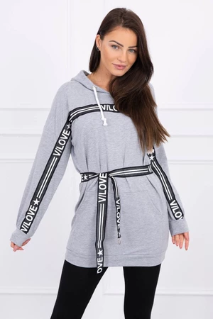 Dress decorated with a tape with gray inscriptions