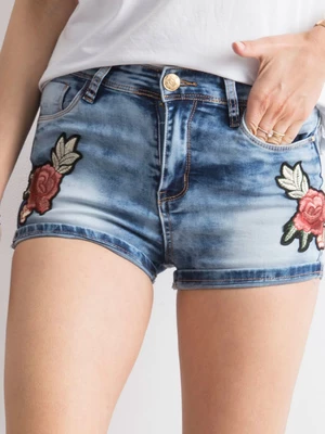 Blue denim shorts with patches