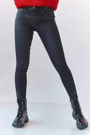 Black denim trousers with frayed hem