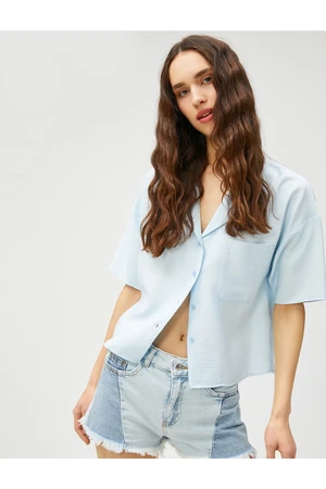 Koton Short-Sleeved Shirt with a relaxed fit, pocket detail and button fastening.