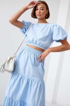 Lady's summer set blouse with a skirt of light blue color