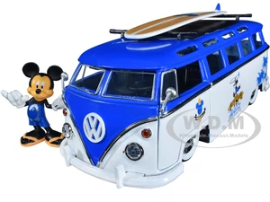 Volkswagen T1 Bus Blue and White with Graphics "Nostalgic Islands Ride the Wave" and Mickey Mouse Diecast Figure and Surfboard "Disneys Mickey and Fr