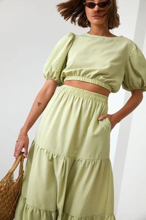 Lady's summer set blouse with a skirt in light khaki color