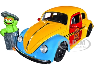 1959 Volkswagen Beetle Taxi Yellow and Blue "Oscars Taxi Service" and Oscar the Grouch Diecast Figure "Sesame Street" "Hollywood Rides" Series 1/24 D