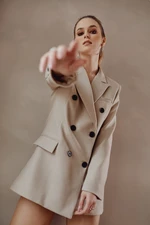 Elegant lady's jacket with double-breasted beige fastening