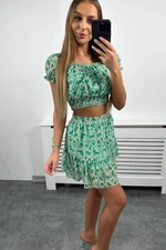 Set with a motif of small green flowers