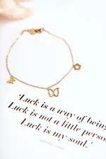 Leg bracelet with bow ties and a flower of gold