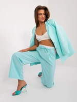 Mint fabric trousers with white belt
