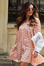 Loose dress with puffed sleeves in light orange