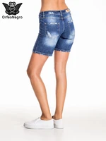 Blue denim shorts with scuffed leg