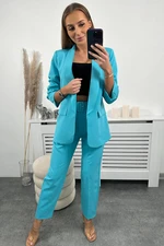 Elegant turquoise jacket and trouser set