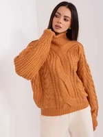 Light brown women's oversize sweater with cables