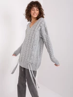 Grey women's sweater with cables