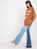 Light brown oversized hoodie with text