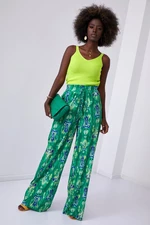 Wide women's trousers with green pattern