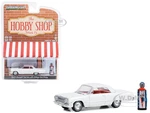 1963 Chevrolet Bel Air White with Orange Interior and Vintage Gas Pump "The Hobby Shop" Series 15 1/64 Diecast Model Car by Greenlight