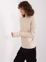 Light beige knitted women's sweater with cable pattern