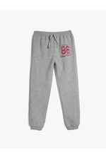 Koton Jogger Sweatpants with Tie Waist and Glitter Print Detail
