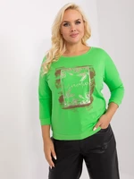 Light green women's blouse with print and rhinestones