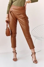 Fashionable brown trousers made of artificial leather for women