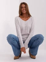 Light grey sweater with cables and long sleeves