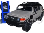 Toyota FJ Cruiser with Roof Rack Brown and Black "Toyo Tires" with Extra Wheels "Just Trucks" Series 1/24 Diecast Model Car by Jada