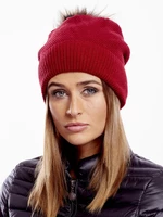 Red cap with fur pompom