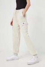 Tepláky Tommy Jeans béžová barva, hladké, DW0DW17313