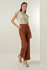 By Saygı A snap fastener at the waist, Pockets and Wide Leg Trousers.