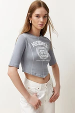 Trendyol Gray 100% Cotton Slogan Printed Sewing Detailed Asymmetric Crop Knitted T-Shirt