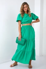 Lady's summer set blouse with a green skirt