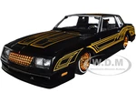 1986 Chevrolet Monte Carlo SS Lowrider Black Metallic with Gold Graphics and Wheels "Lowriders" Series 1/24 Diecast Model Car by Maisto