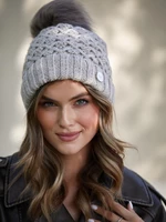 Warm beige winter cap with pompom