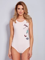 Light pink cotton body with decorative patches