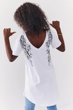 Stylish white tunic with wings on the back