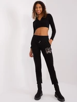 Black sweatpants with asymmetrical legs