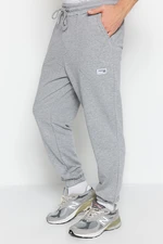 Trendyol Men's Gray Melange Regular Fit Sweatpants with Labels, Appliques, Stitched Pockets.