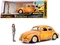 Volkswagen Beetle Weathered Yellow with Robot on Chassis and Charlie Diecast Figurine "Bumblebee" (2018) Movie ("Transformers" Series) "Hollywood Rid Volkswagen Beetle Weathered Yellow with Robot on Chassis and Charlie Diecast Figurine "Bumblebee" (2018) Movie ("Transformers" Series) "Hollywood Rid